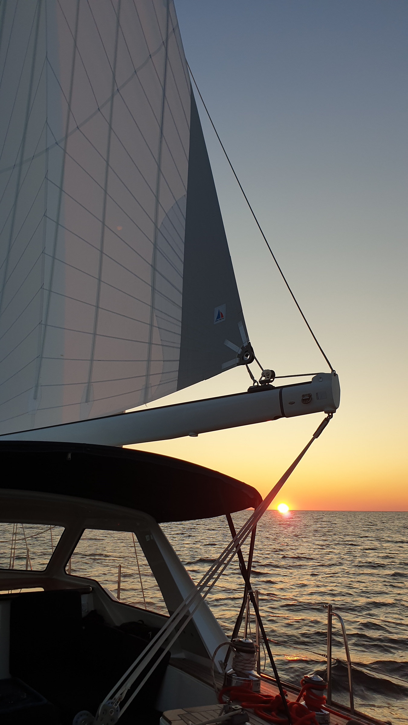 Sunset shortly after departure—but it was a bright night, ideal for sailing